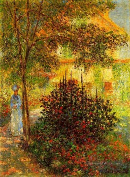 Camille Monet dans le jardin de la maison à Argenteuil Claude Monet Peinture à l'huile